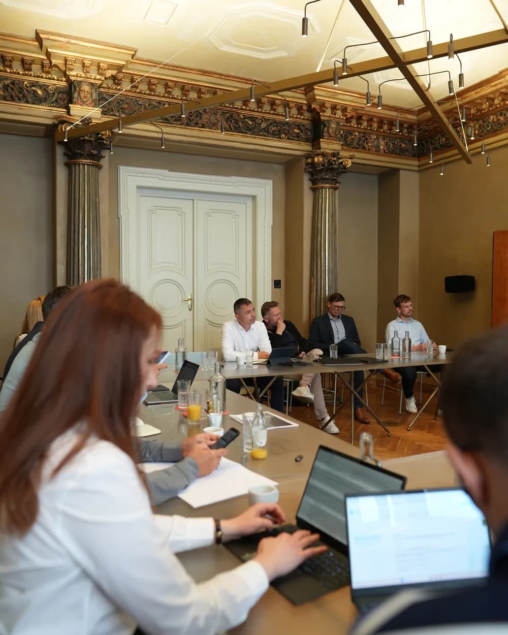 An iLead Institute leadership meeting in a historic hall
